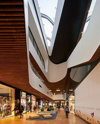 The layered architecture features skylights that bring plenty of light into the galleries