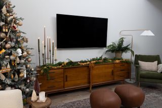 a living room media unit styled for christmas