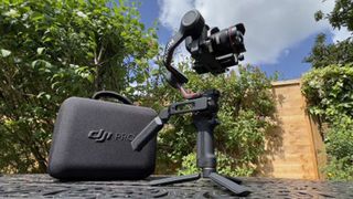 DJI RS 3 gimbal and case in sunny garden