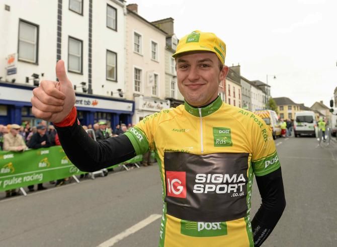 The newest race leader Peter Hawkins (IG Sigma Sport) gives a 'thumbs up' after pulling on the yellow jersey
