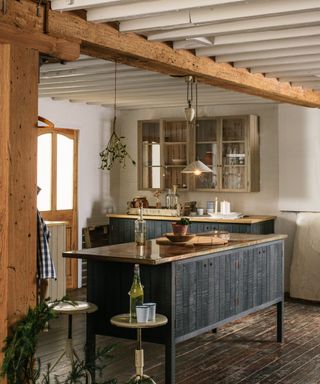 A wood kitchen with mistletoe hung from the ceiling