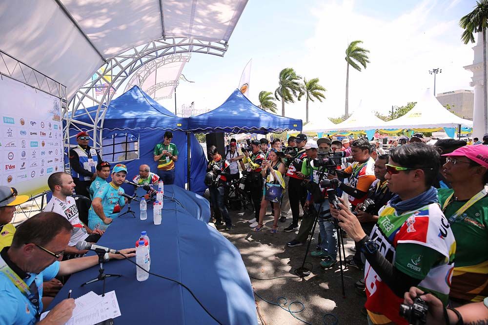 The post stage press conference is done outdoors