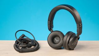 Beyerdynamic DT 275 Pro photographed in front of a blue background