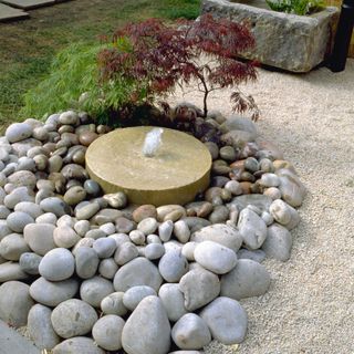 Zen garden ideas - water fountain amongst gravel
