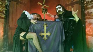 King Diamond posing for a photograph with a fake nun in 1983