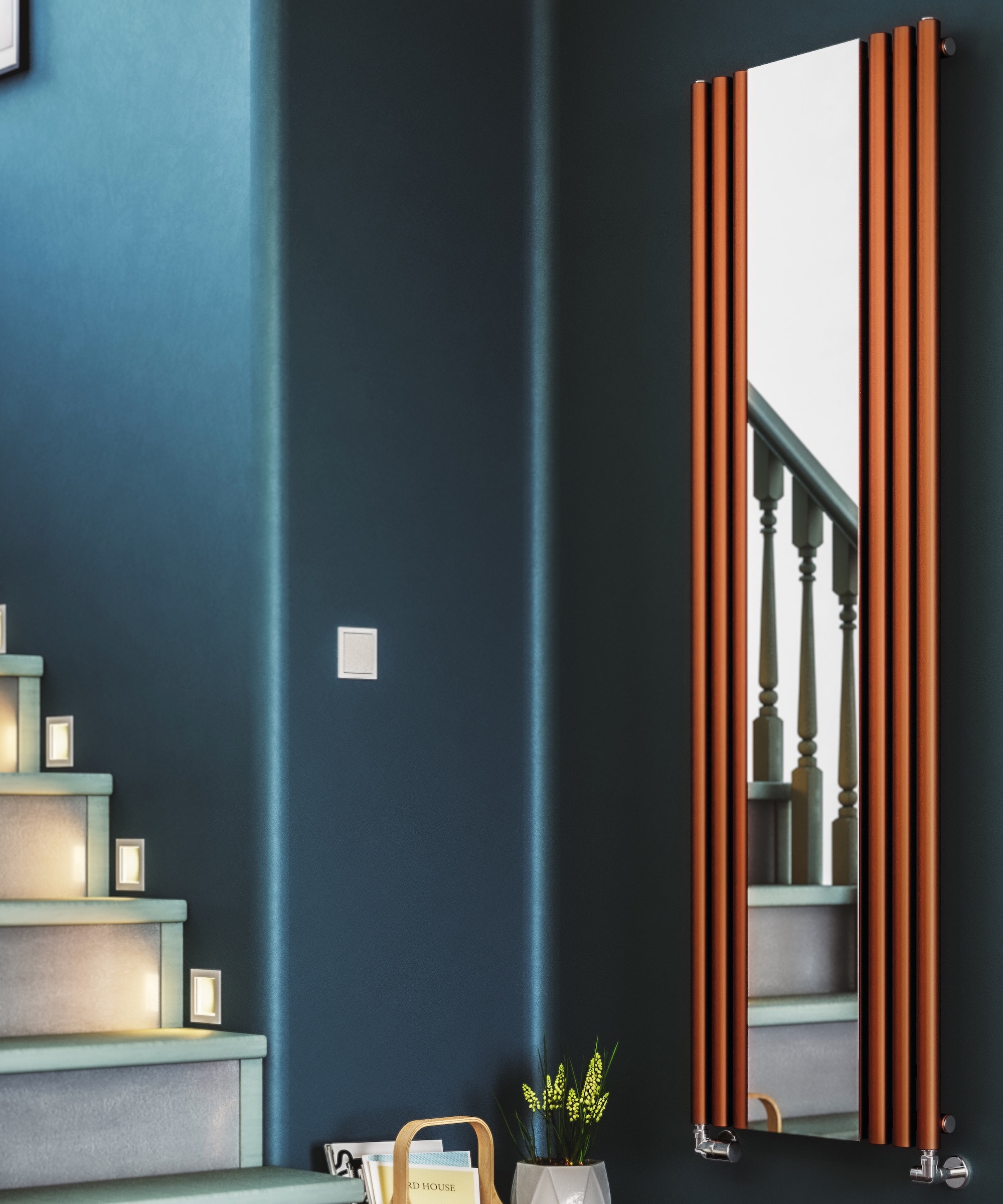 Copper column radiator with mirrored centre in a blue hallway