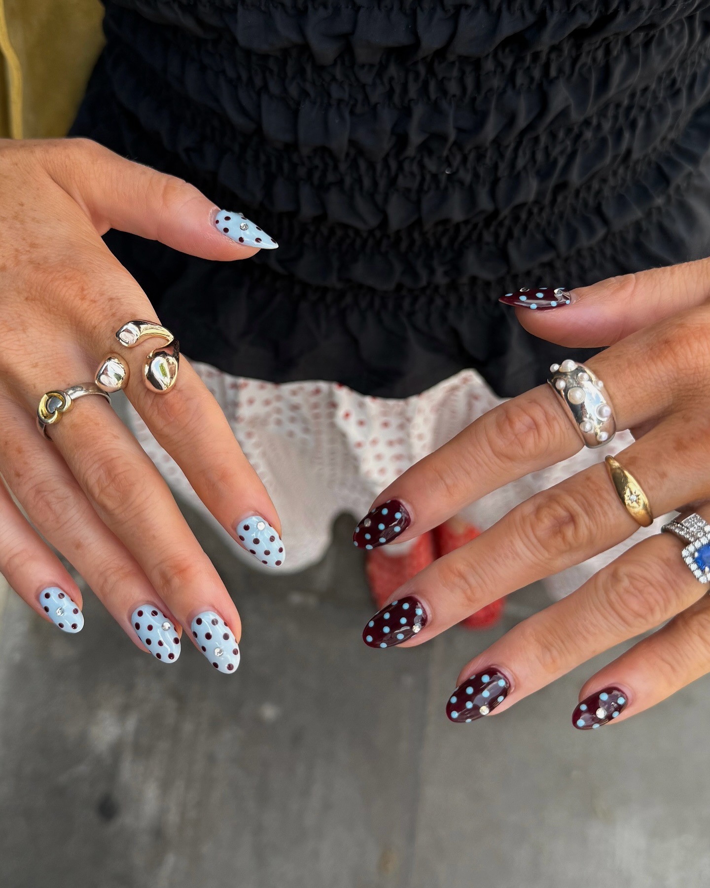 A brown and blue polka dot manicure