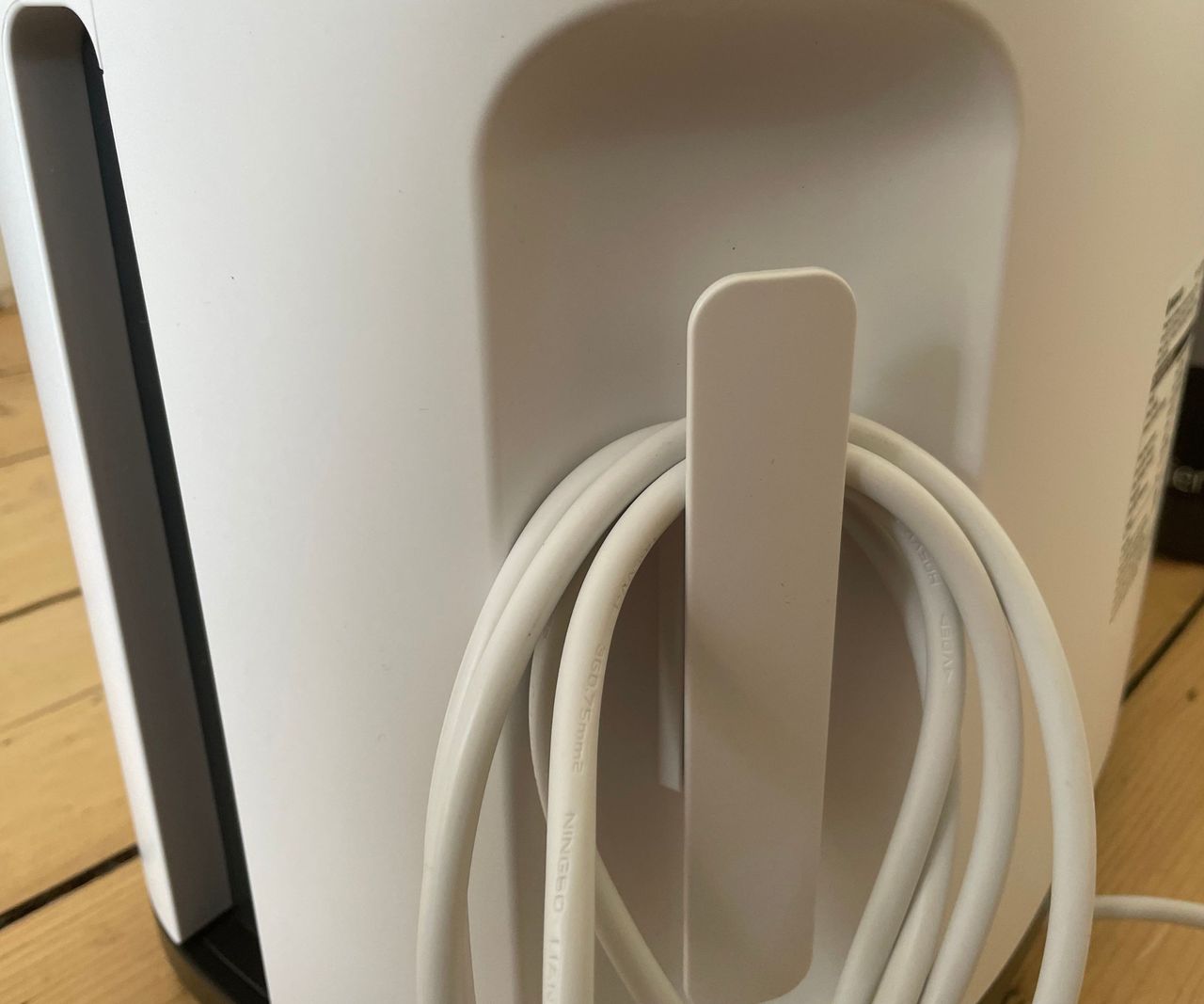 Wood's MDK26 dehumidifier cable wrapped neatly around its useful storage hook