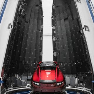 A Tesla Roadster tops SpaceX's Heavy launcher.