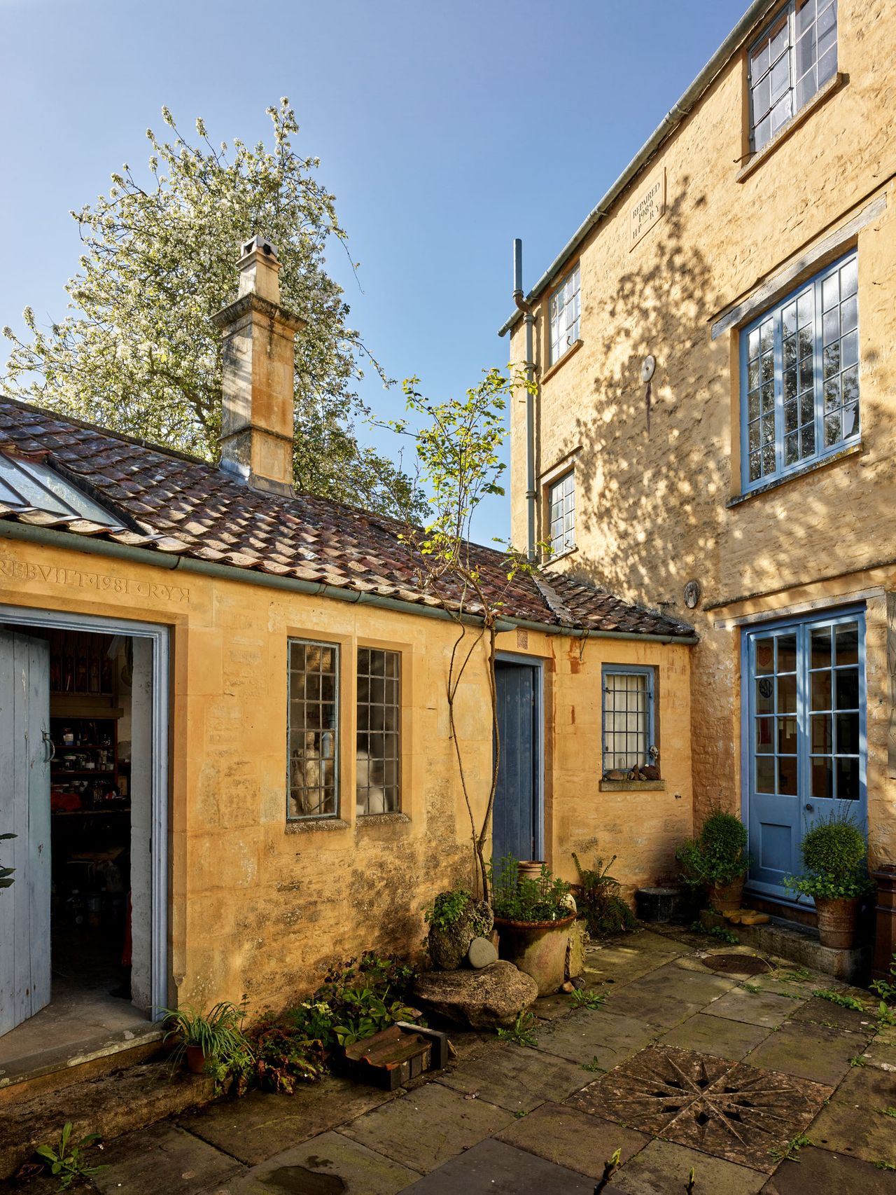 Fig 1: The lime-washed courtyard. Note the carved drain cover. 7 Park Street, Cirencester.