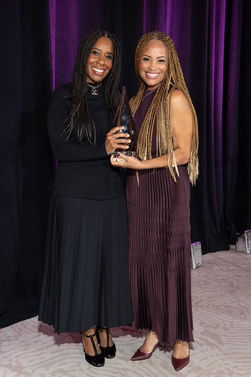 Tara Duncan (l.), president of Onyx Collective, receives The WICT Network Southern California&rsquo;s LEA Award from Ayo Davis, president of Disney Branded Television.