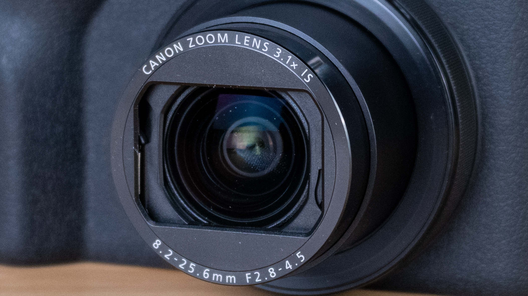 A black Canon PowerShot V1 compact vlogging camera