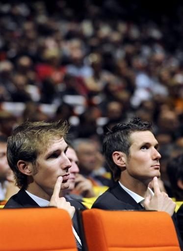 The Schleck brothers study the route