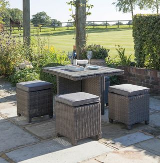 compact outdoor dining set on a patio