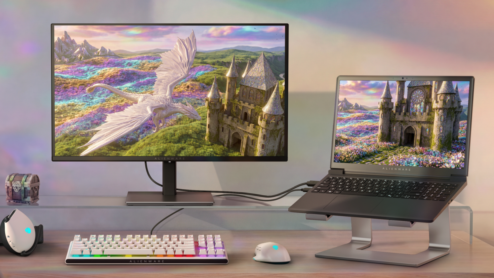 Flat 27-inch 16:9 QHD Alienware 27 display on a flat rectangular base stand, setup alongside an Alienware laptop.