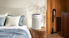 Levoit air purifier on a bedside table and the levoit vacuum stood in a wooden home