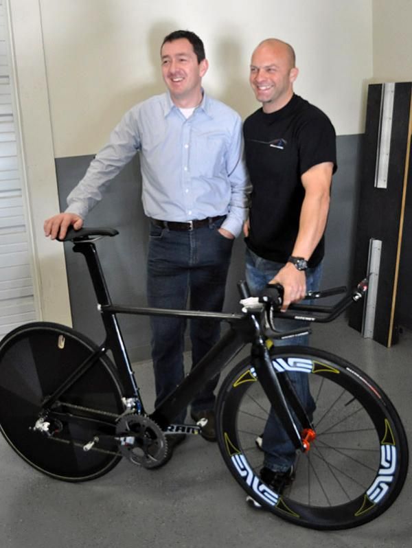 Chris Boardman, left, and Mike Giraud pose with a prototype Boardman time trial bike.