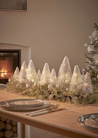 White Christmas trees on the table