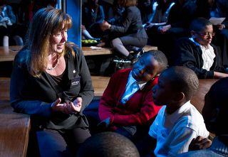 NASA Deputy Administrator Lori Garver talks with middle and high school students at a NASA forum to encourage students to pursue careers in science, technology, engineering and mathematics, March 22, 2011 in New York. Fashion designer Donna Karan's Urban 