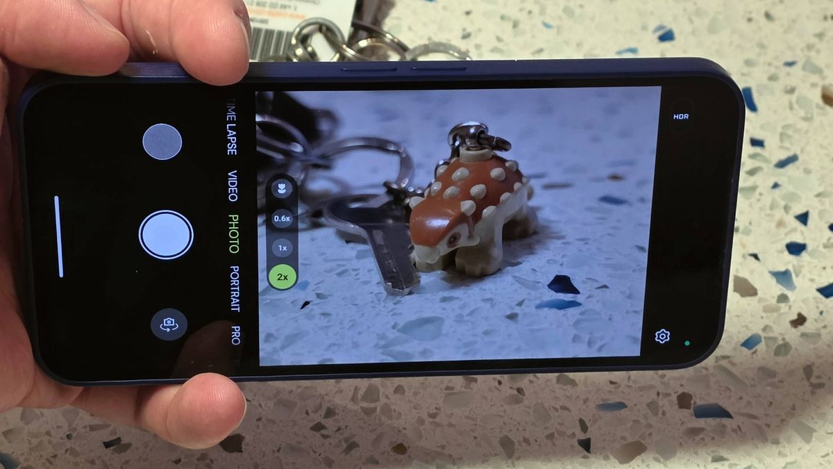 The Fairphone 6 Plus camera app, showing a Lego dinosaur in the viewfinder.