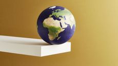 world globe balanced on a shelf