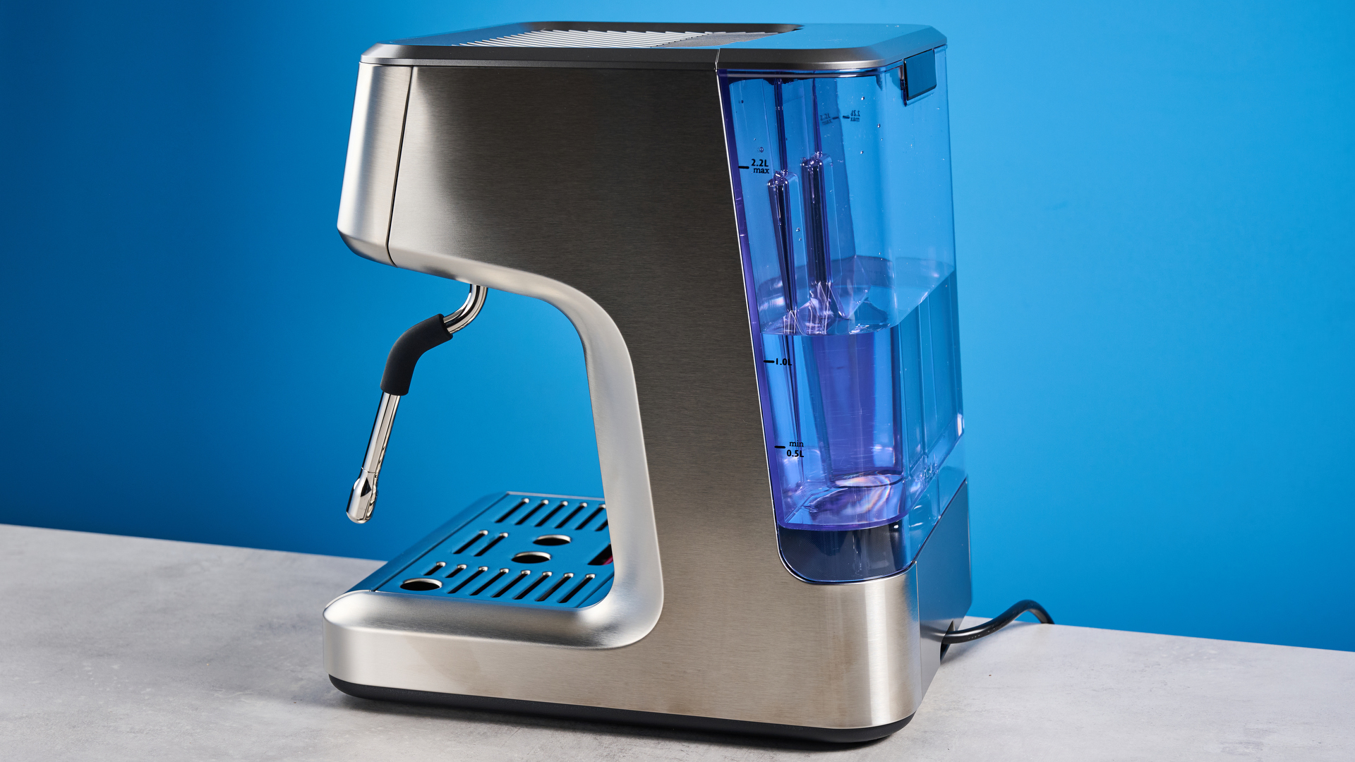 the casabrews ultra espresso machine with 20 bar pressure, a steam wand, LED screen, timer, and tamper accessories, photographed against a blue background