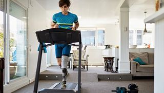 Man running on home treadmill