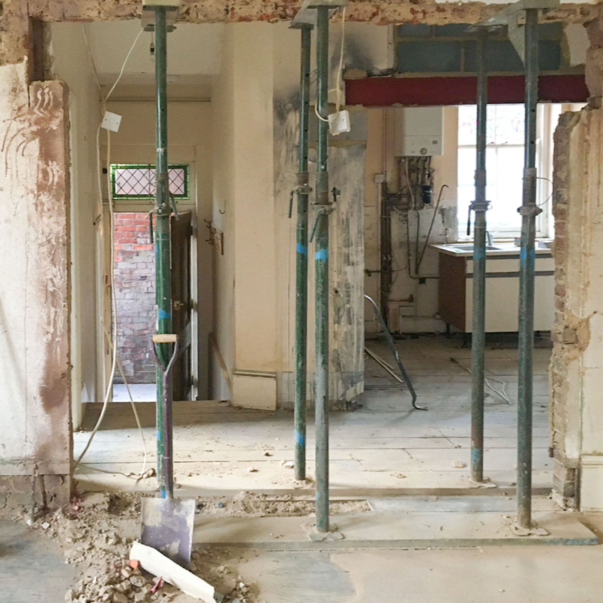 Mid wall being taken down between rooms in renovation