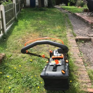 Worx WG779 lawn mower ready to cut grass