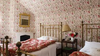 Maximalist bedroom with floral wallpaper