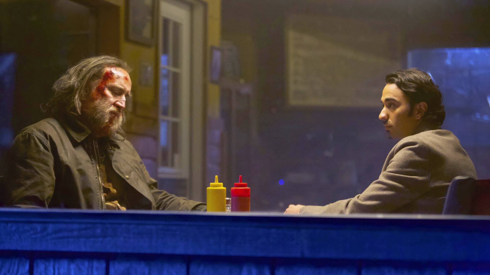(L-R) Nicolas Cage as Robin "Rob" Feld and Alex Wolff as Amir in "Pig"
