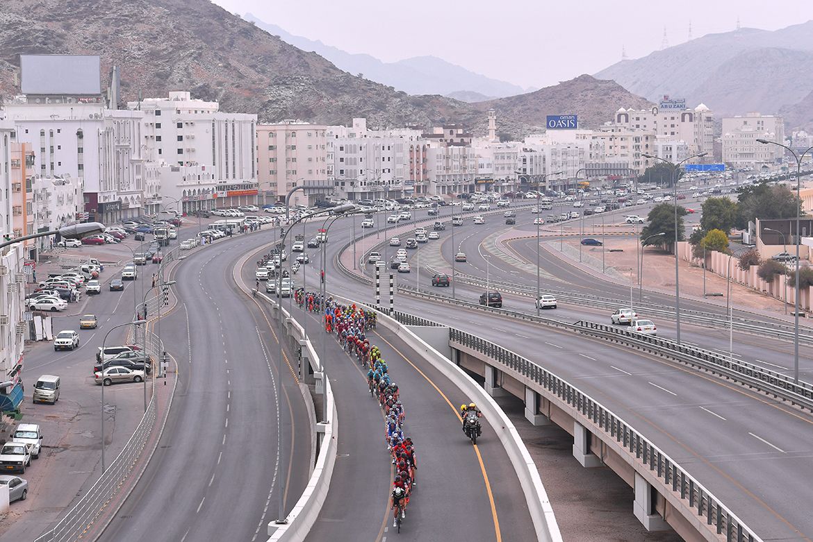 The peloton heads through town
