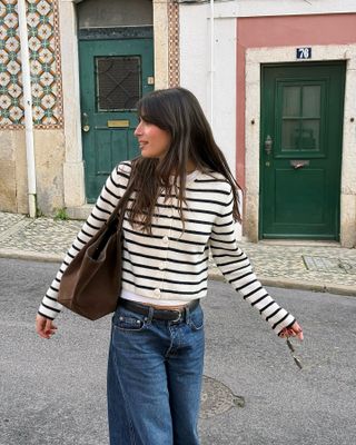 French influencer wearing a striped cardigan