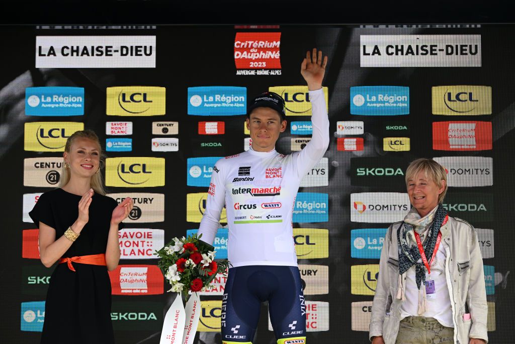 LA CHAISEDIEU FRANCE JUNE 05 Rune Herregodts of Belgium and Team Intermarch Circus Wanty White Best Young Rider Jersey celebrates at podium during the 75th Criterium du Dauphine 2023 Stage 2 a 1673km stage from BrassaclesMines to La ChaiseDieu 1080m UCIWT on June 05 2023 in La ChaiseDieu France Photo by Dario BelingheriGetty Images