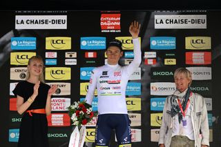 LA CHAISEDIEU FRANCE JUNE 05 Rune Herregodts of Belgium and Team Intermarch Circus Wanty White Best Young Rider Jersey celebrates at podium during the 75th Criterium du Dauphine 2023 Stage 2 a 1673km stage from BrassaclesMines to La ChaiseDieu 1080m UCIWT on June 05 2023 in La ChaiseDieu France Photo by Dario BelingheriGetty Images