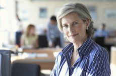 Mature businesswoman in office, portrait, close-up