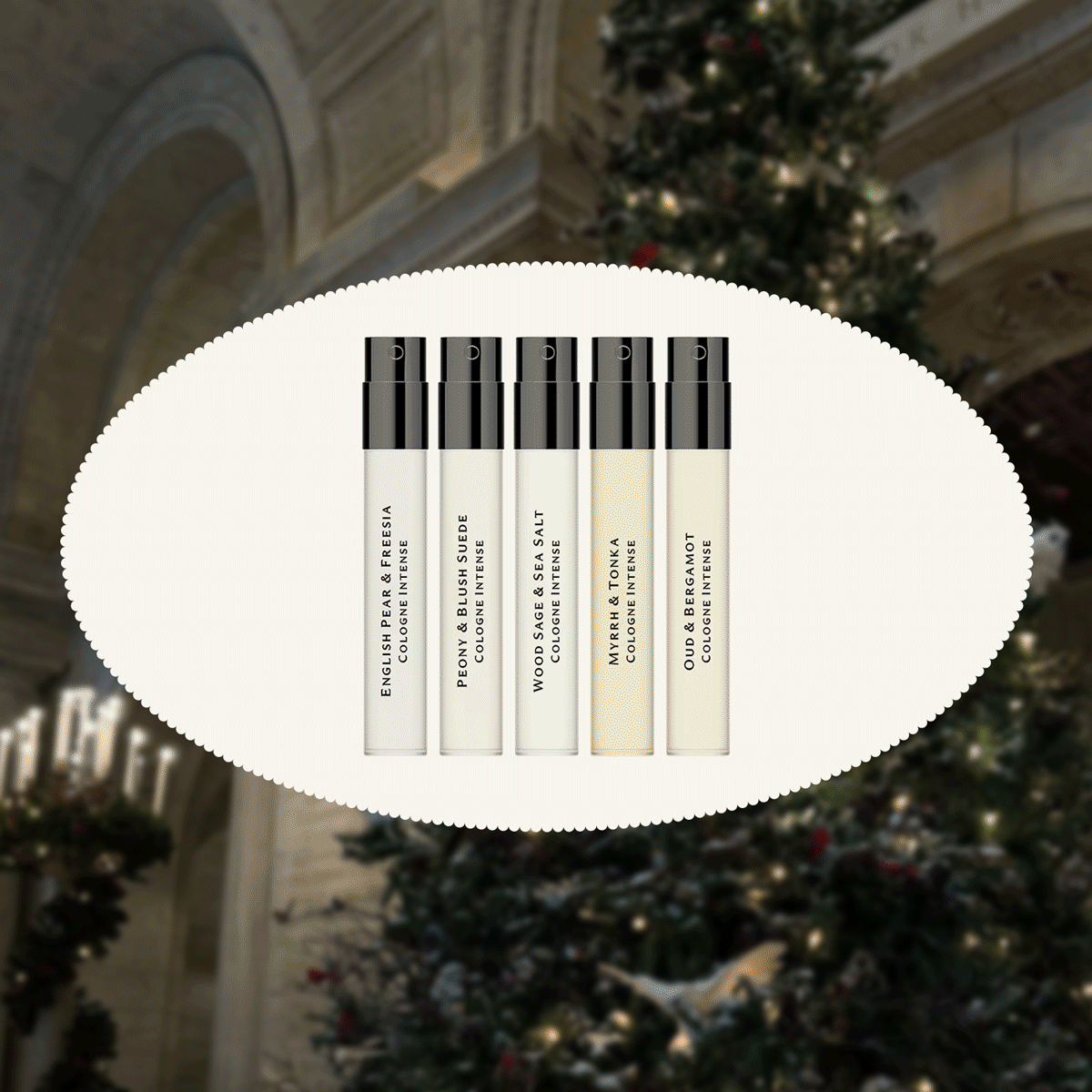 A Christmas tree in the background with chic under-$25 holiday gift ideas from fragrance, sets, earrings, combs, and books. 