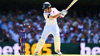 Ollie Pope of England is bowled by Mitchell Starc of Australia during day one of the Second 2025/26 Ashes Series Test Match between Australia and England at The Gabba on December 04, 2025 in Brisbane, Australia. 