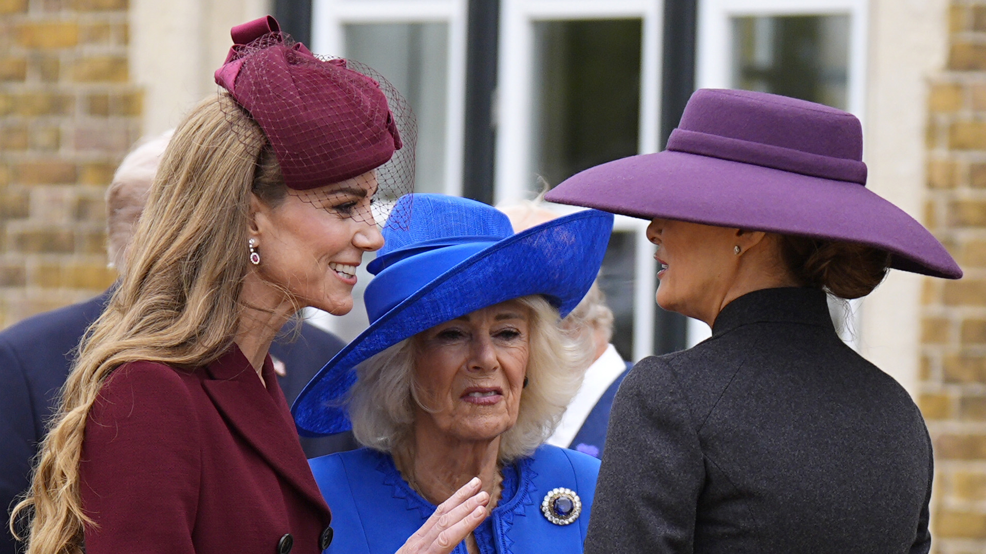 Kate MIddleton wears a wine coat dress and greets Melania Trump during the US state visit on September 17