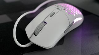 A Glorious Model O Eternal gaming mouse on a mouse mat with the lighting enabled.