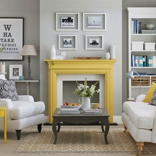 grey living room with yellow painted fireplace