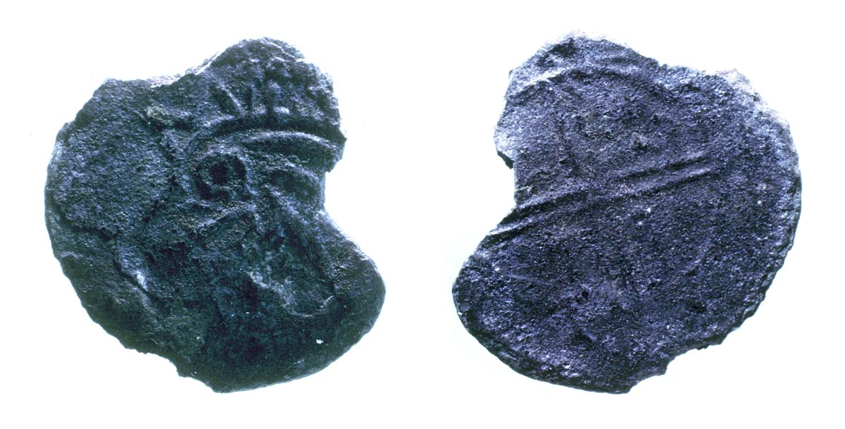 The front and back of a 11th-century Norse coin. One side has squiggly lines and the other has a cross in a circle.