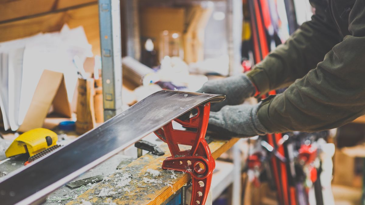 A skier waxing skis