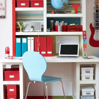 open shelving desk area with storage boxes and files