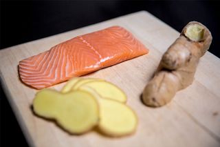 Ginger and salmon on a wooden board