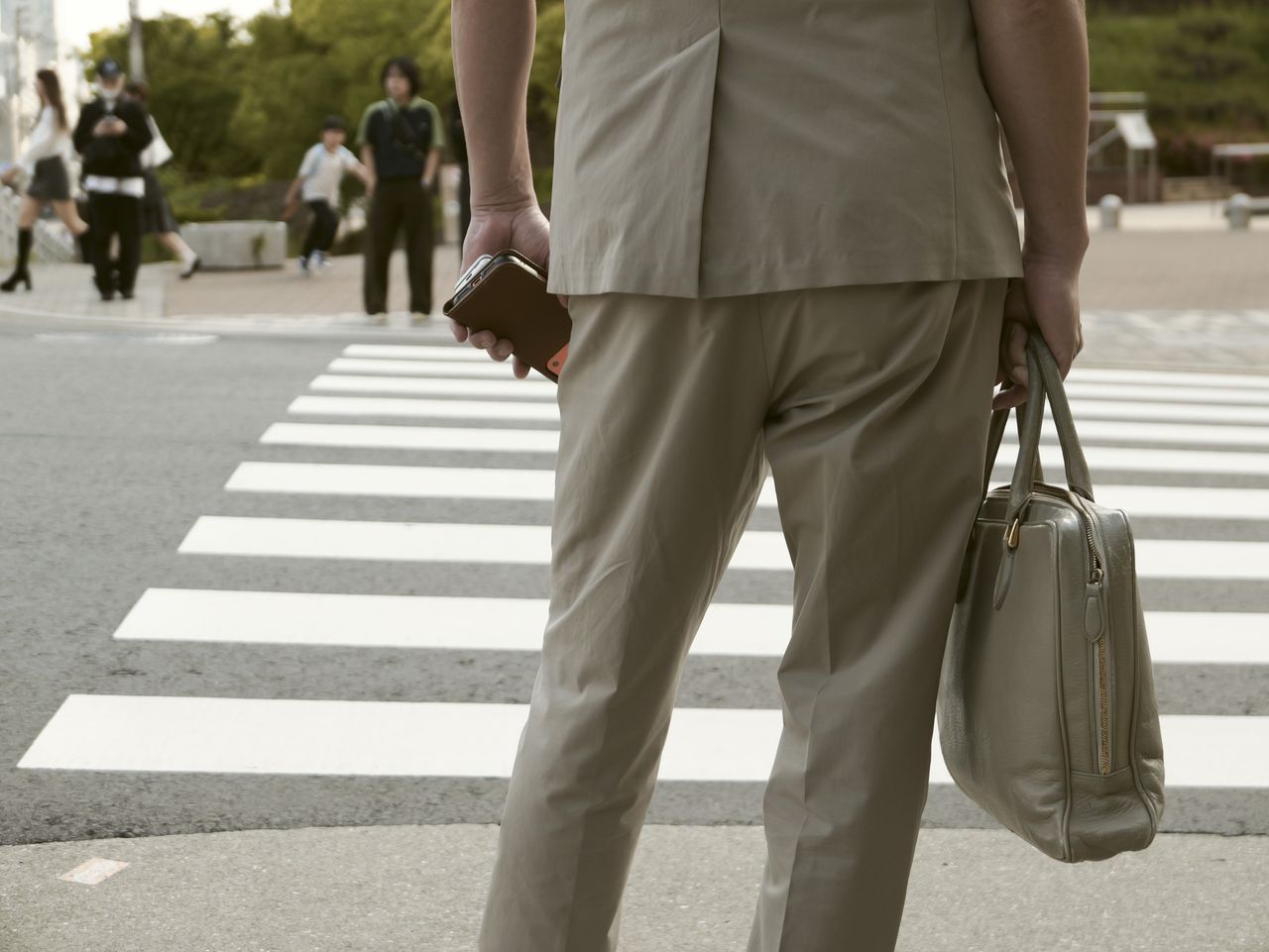 Sample image taken with the Panasonic Lumix L10; stylish man stood at a road crossing in Osaka, Japan