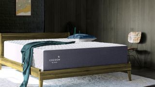 The best Cocoon by Sealy mattress sales, deals and discount codes: Image shows the Cocoon by Sealy Chill Mattress in a bedroom on a wooden frame 