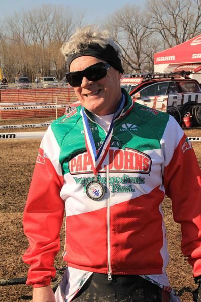 Tim Omer of Louisville, KY celebrating his race finish in the 60-64 men's category at the UCI world cyclo-cross championships