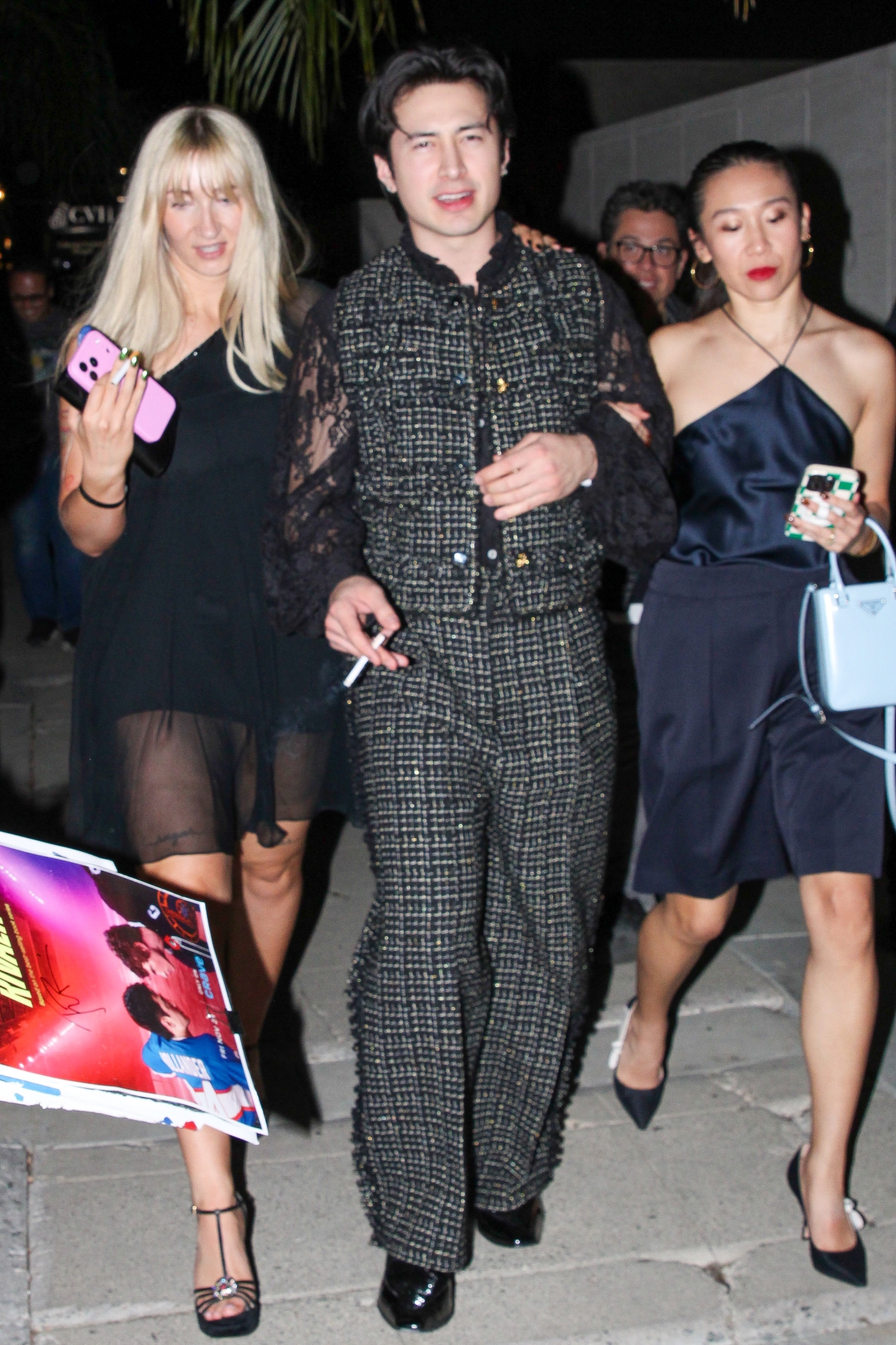 Hudson Williams wears a naked lace shirt and a tweed suit to reunite with Heated Rivalry co-star Connor Storrie at the CAA pre-Oscar party at Living Room on March 13, 2026 in Los Angeles, California