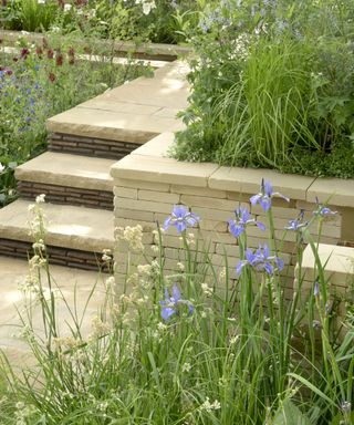 Paved area with steps and built in planting beds
